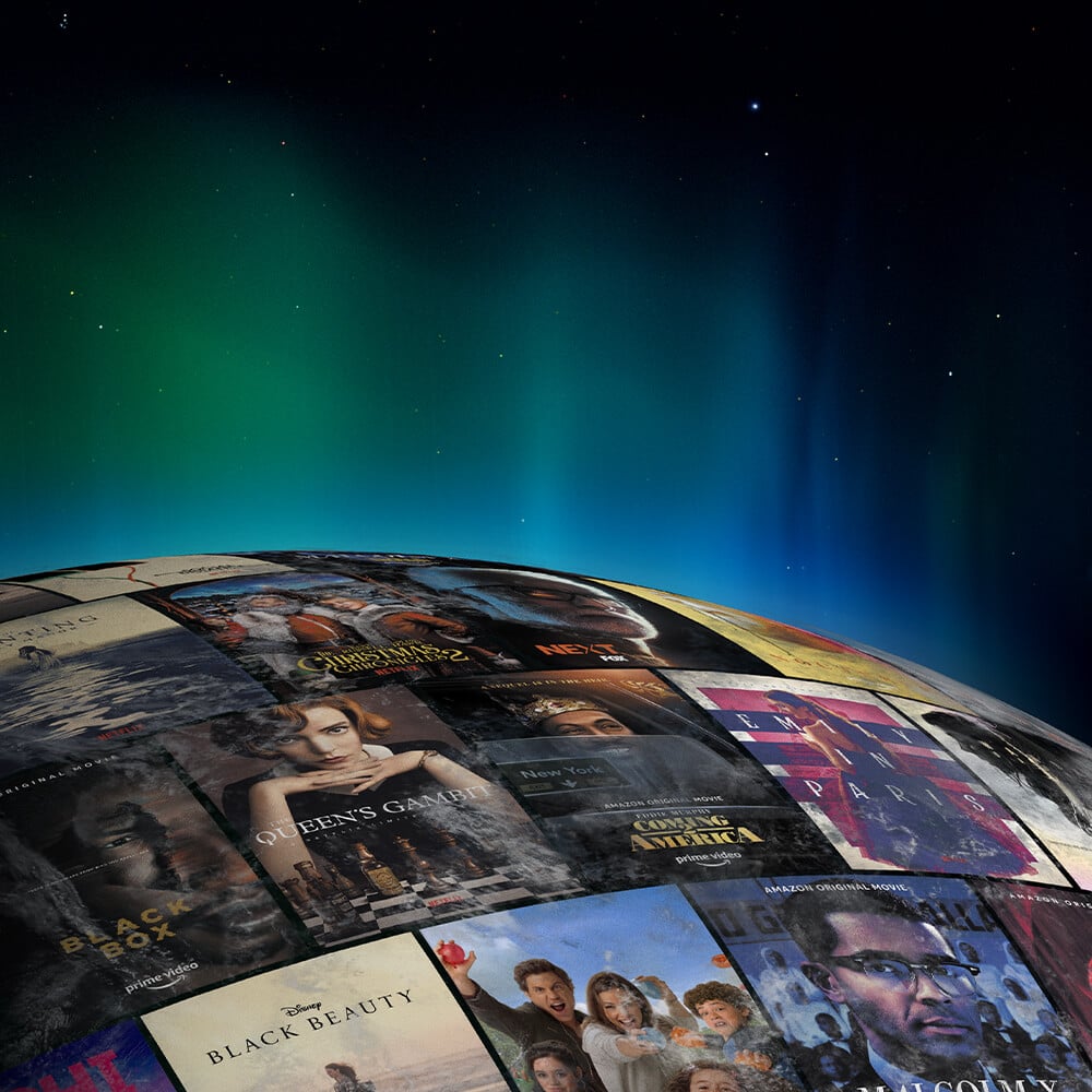globe with a surface made of credit posters with northern lights floating above the surface